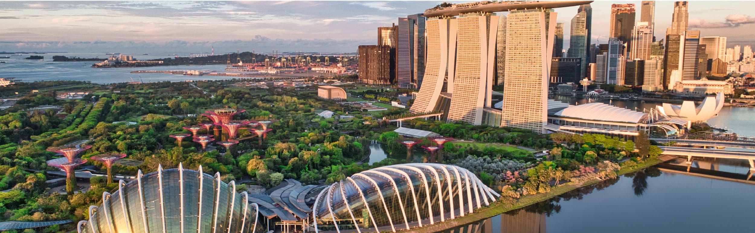 Cityscape of Singapore featuring iconic landmarks with a focus on sustainability.